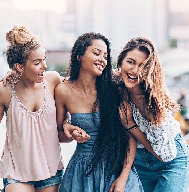 three young women smiling