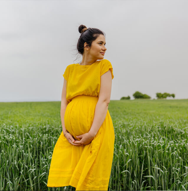 pregnant woman in field