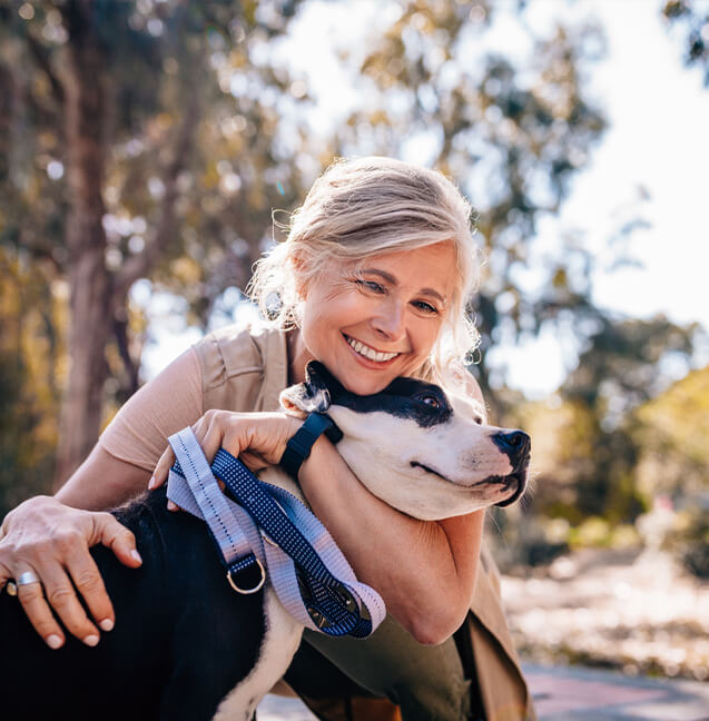 woman hugging her dog