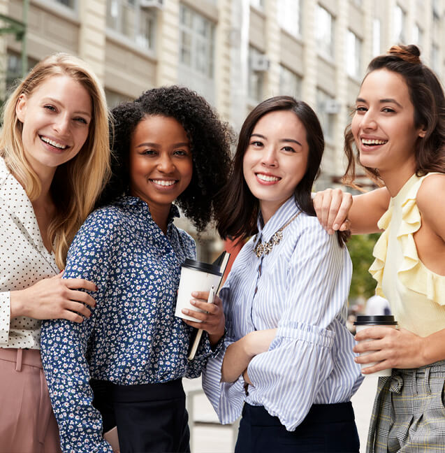 four women smiling