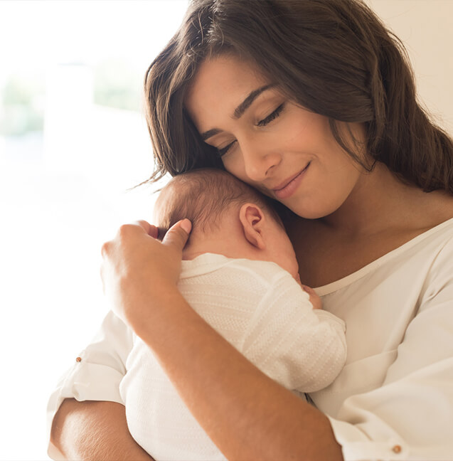 mother holding baby