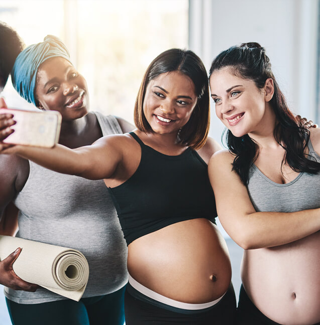 three pregnant woman taking a selfie