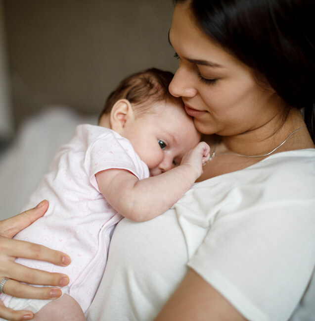 woman holding baby 