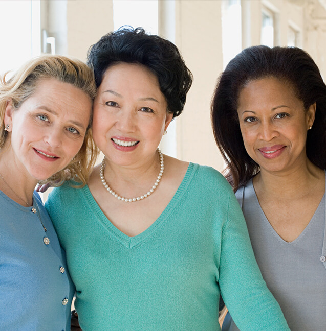 three woman smiling