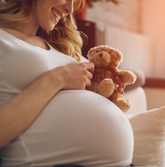 buffalo-grove pregnant woman holding teddy bear